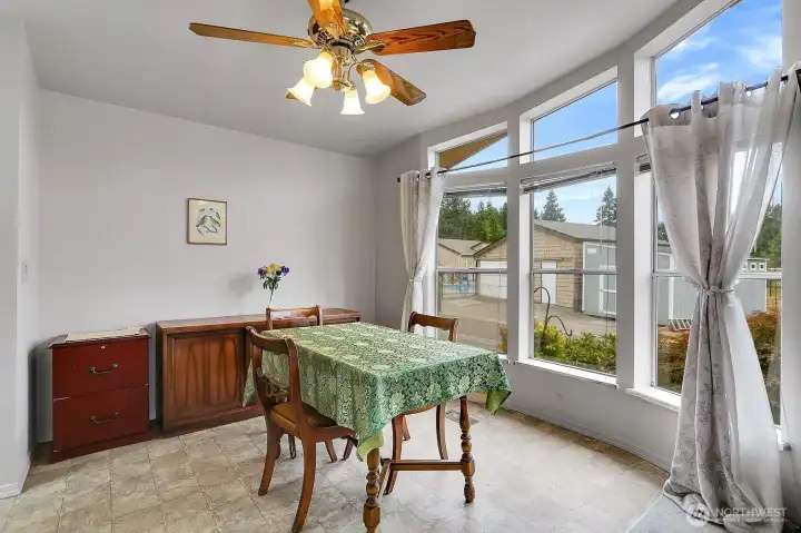 Bright and Cheery dining area with lovely views is conveniently located off of the kitchen.