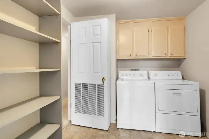 Utility room offers full size laundry machines, ample storage/pantry space and a NEW (Feb'25) Gas furnace/Heat pump and central A/C. Convenient side door entry as well.