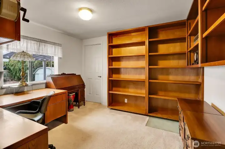Bedroom #3 is being used as an office but can easily be converted to a bedroom with the large closet. Look at these beautiful built in shelves and bookcase.