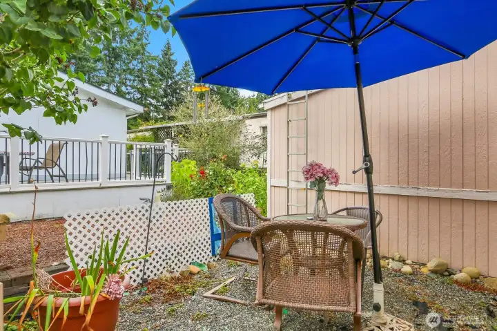 Your own little backyard oasis with another dining/gardening area. Generator that stays with the home is also here.