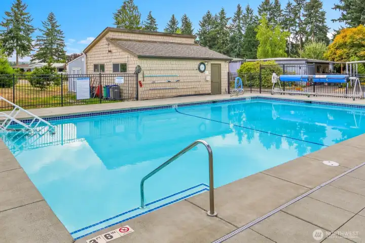 Beautiful, well-maintained pool with sun-bathing area is a seasonal bonus!