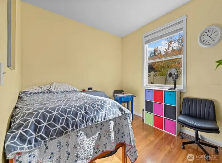 Main floor bedroom with walk in closet and 3/4 bathroom adjacent is perfect for guests or multi-generational living!