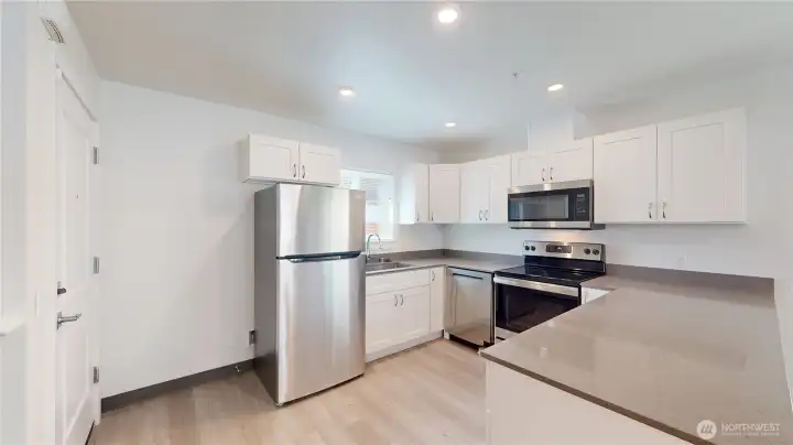 Actual unit 13813 -Stainless steel appliances, quartz countertops and lvp floors