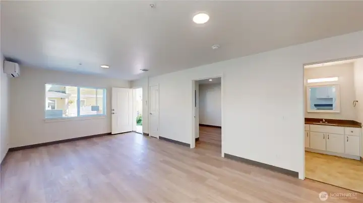 Lots of natural light looking out to courtyard away from parking lot. Shown here is a main floor bedroom and bathroom for privacy from second floor and no stairs