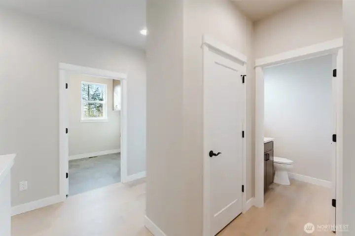 Powder Bathroom on the right, laundry straight ahead