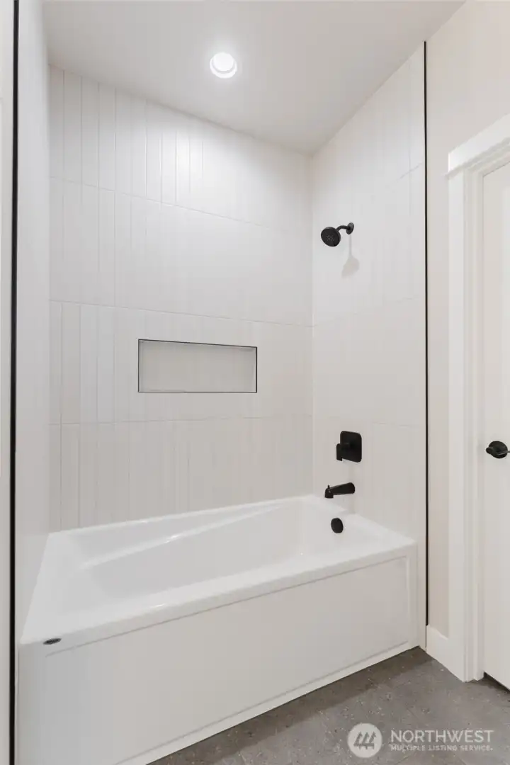 Primary Bathroom large tub and custom tiled shower. Glass door still to come.