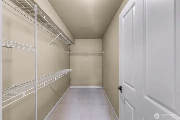 Primary bedroom walk-in closet