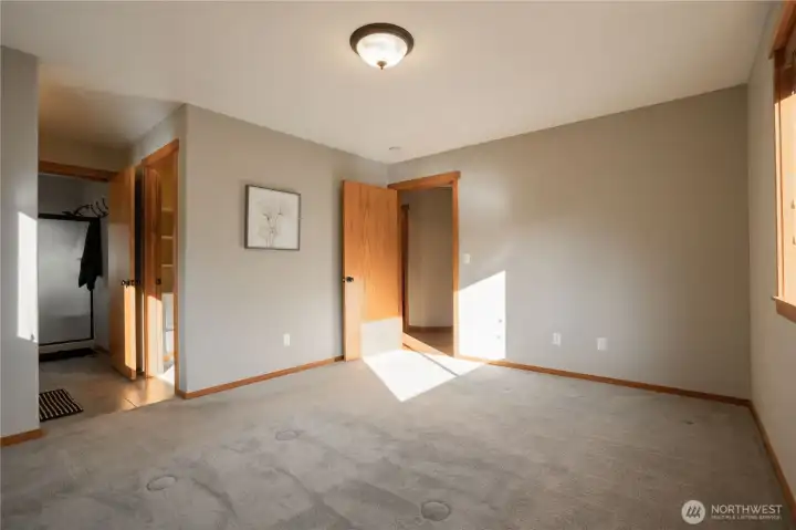 Primary Bedroom, Bathroom and the open door leads to walk-in closet.