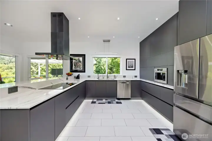 Remodeled kitchen with Futuro Futuro hood, Bosch appliances, Bellmont cabinetry, quartz counters, tile floors, and built-in water filtration—perfect for gourmet cooking.