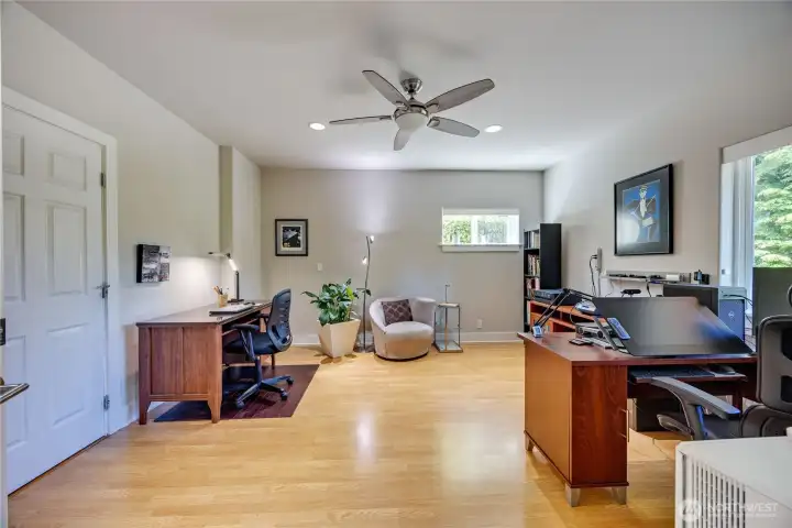The lower level office is spacious enough for two separate desks, bookshelves, and a cozy seating area, plus it's light and bright with natural light and all LED lighting throughout the house.