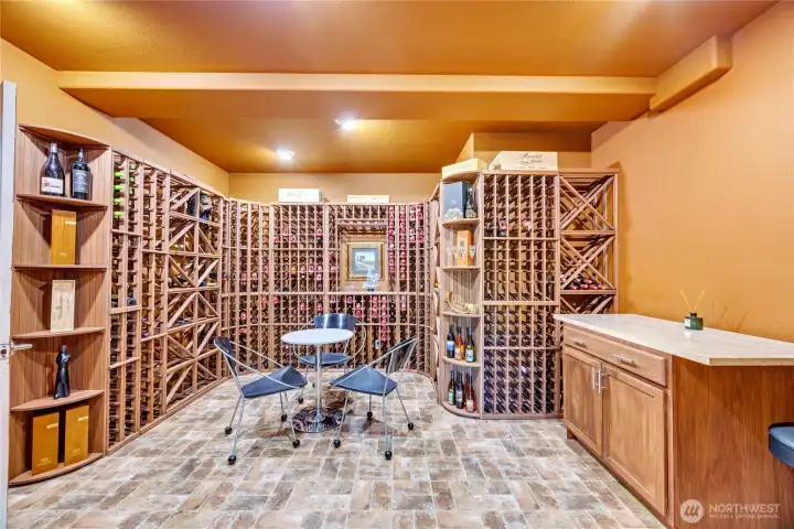 The large wine cellar is complemented by a finished adjacent room ideal for storage, exercise, or flexible use.