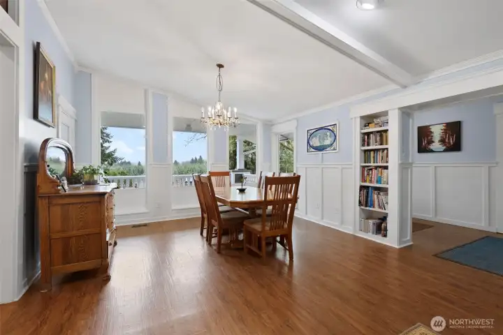 Vaulted ceilings & large windows bringing light into the room is such a nice feature for the dining area. Built in shelves and wood work show the extra touches that you will surely love.