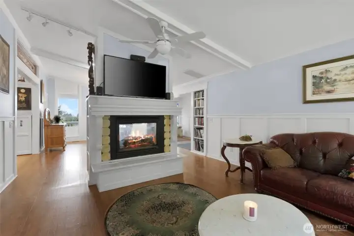 Living room side of the duel sided fireplace. Very cozy place to relax after dinner.