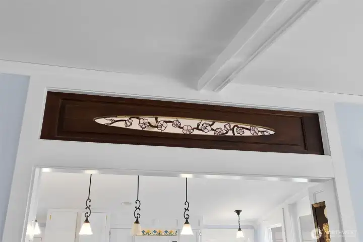 Stained glass in wood above the kitchen/dining door way. What a special feature to have!