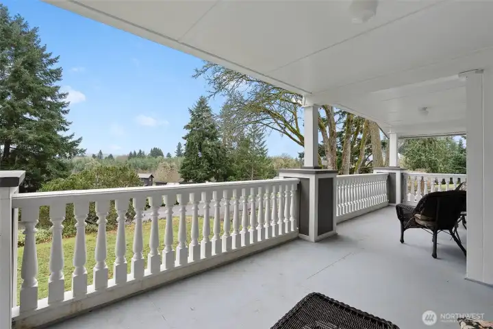 Cover porch with custom railings. This is a large space to have for entertain guests or start your morning or end your day.