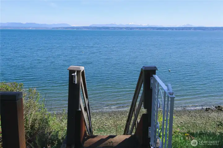 Mid-bank, with stairs for direct beach access