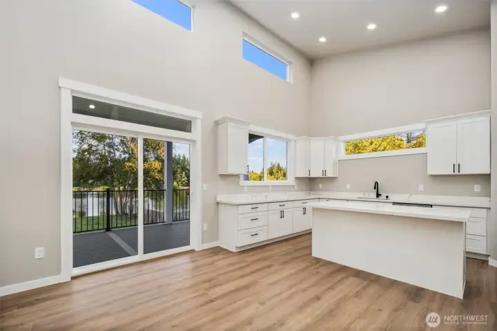 Designed w/ soaring ceilings & a bright, open-concept.