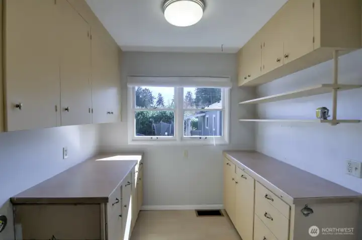 Here's a true utility room- extra space opposite the laundry area.