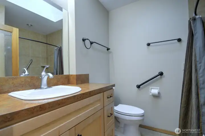 Skylight in bath for that continued warmth of natural light.