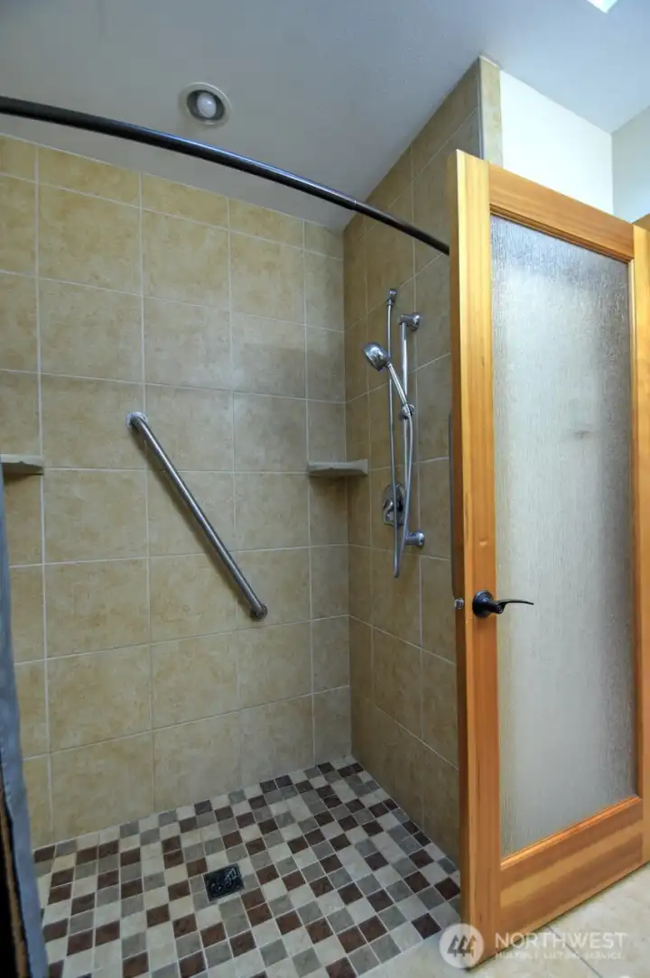 Tiled walk-in shower is nice luxury/functional touch