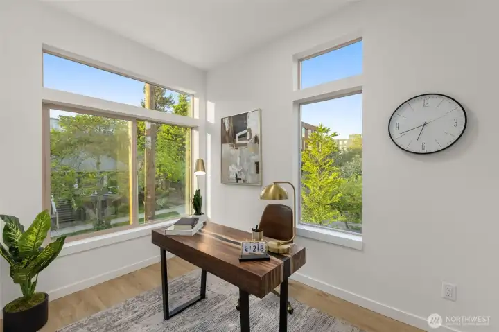 Surrounded by natural light and treetop views, this flex room is the perfect WFH setup or reading retreat.