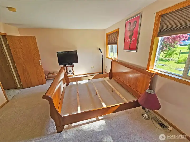 Primary Bdrm with big windows to view the pleasant outside landscaping