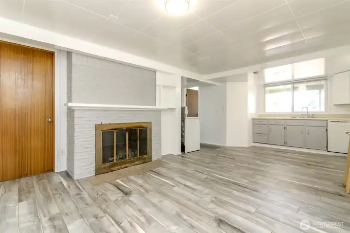 living area looking at fireplace and kitchen living area looking at fireplace and kitchen