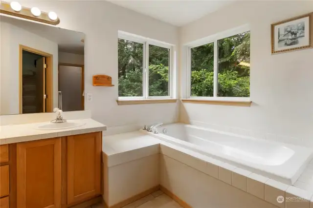 Wait there is more! The En Suite has a magnificent corner window overlooking the woods