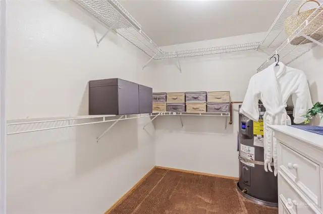 XL walk-in closet with brand new hot water heater and built-in shelving.