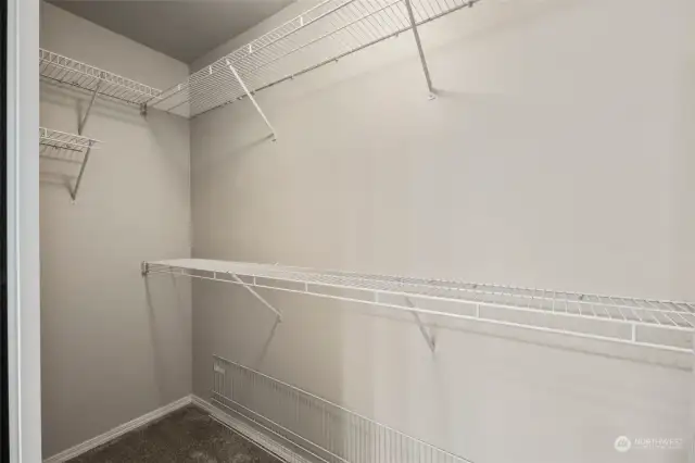 This walk in closet is large, you've got immense space in here.