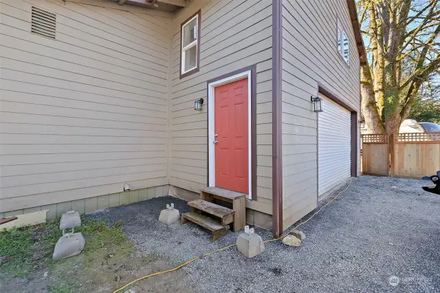 Side entrance to stairway leading up to the upstairs bedroom/flexroom. The second entrance could be used for a accessory dwelling unit/MIL apartment.