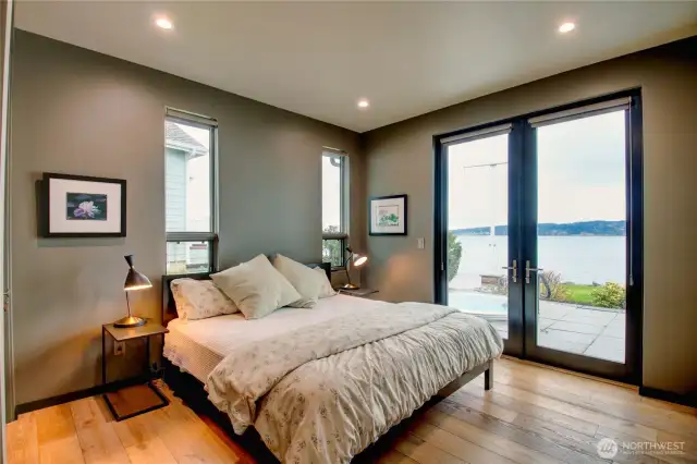 2nd bedroom with plenty of indirect lighting, glass doors with access to patio.  How about a quick dip in the hot tub?