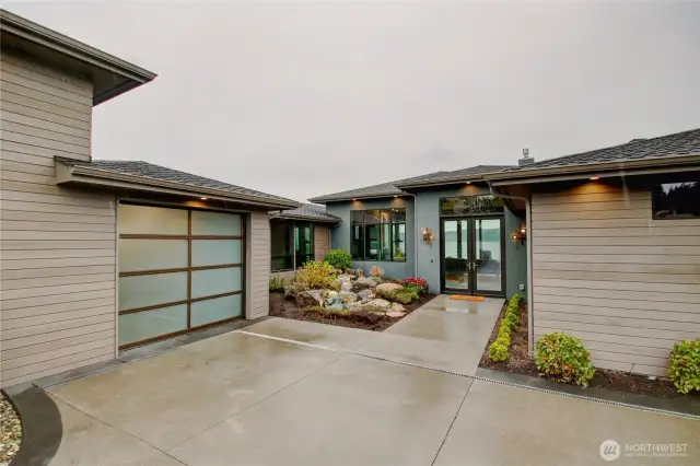 Tranquil waterfall feature welcomes you. Level entry parking garage