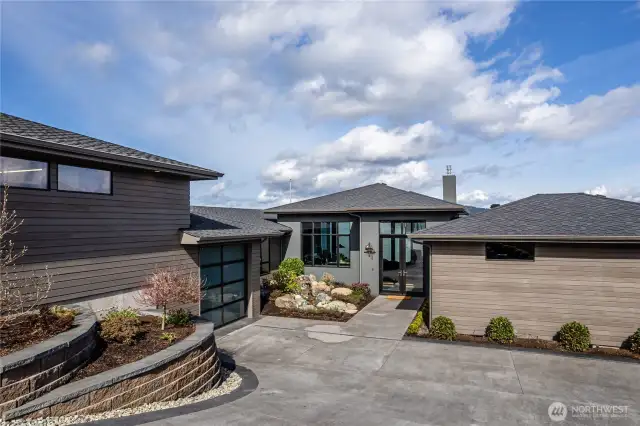 Notice the clear cedar siding, recently stained, together with accents of stucco.