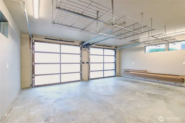 Upper level double car garage parking, with storage and worksink