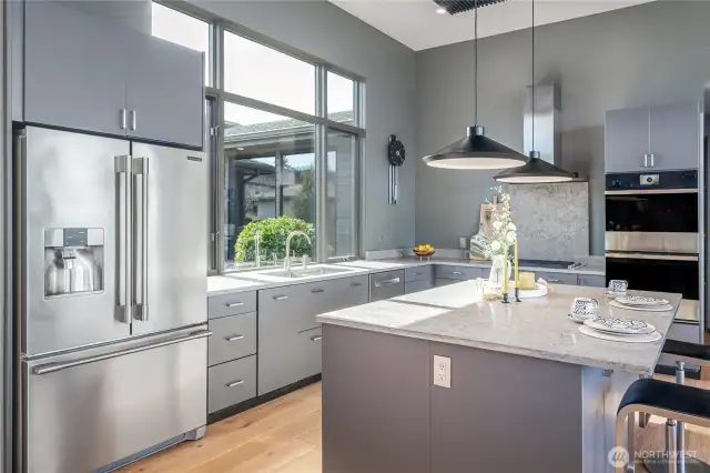 Custom cabinetry, Stainless-Steel appliances, large center Island , Quartz countertops, Gas Jenn-air Cooktop, double oven and undercounter microwave