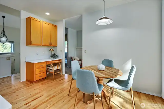 The wood floors were refinished late 2024. The eat-in kitchen opens into the backyard via large slider.