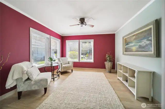 Just to your left of entering home is a sunlit den area.