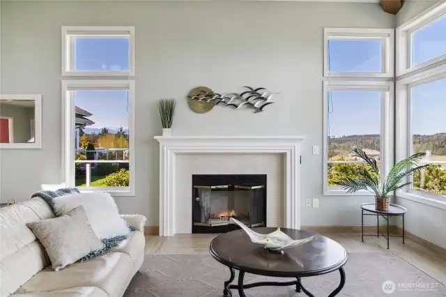 Windows letting in light throughout the day and providing alluring water and mountain views.