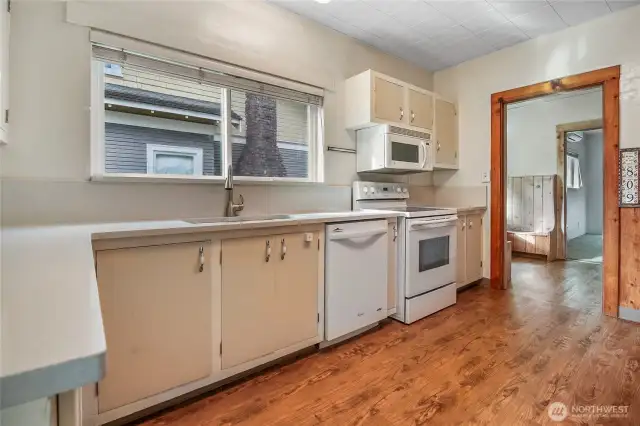 Luxury vinyl plank flooring flows throughout the kitchen & dining area.