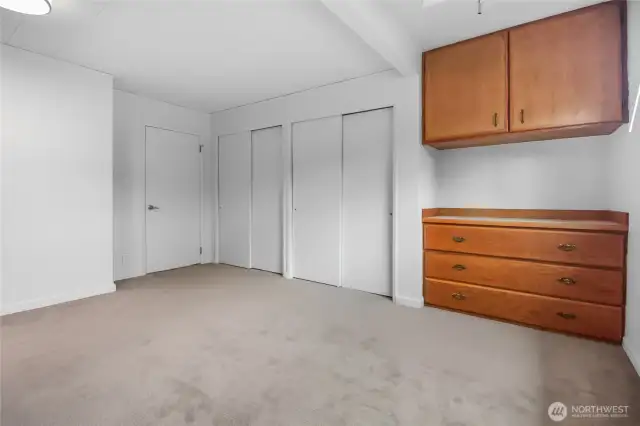 Dual closets plus a built-in dresser provide ample storage space.