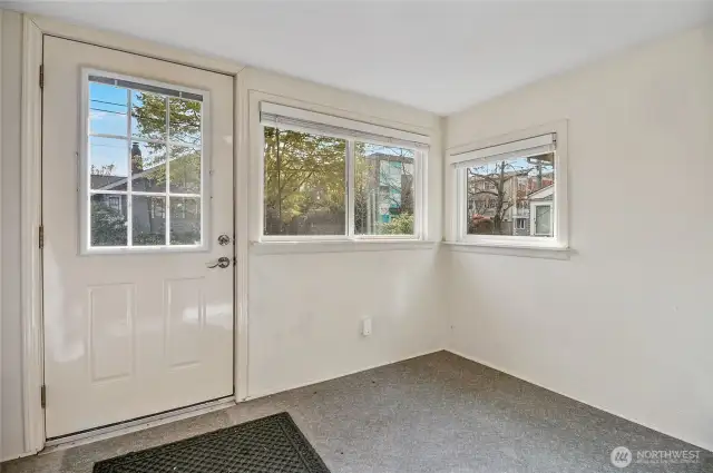 The enclosed back porch is great for storing bikes & outdoor gear.