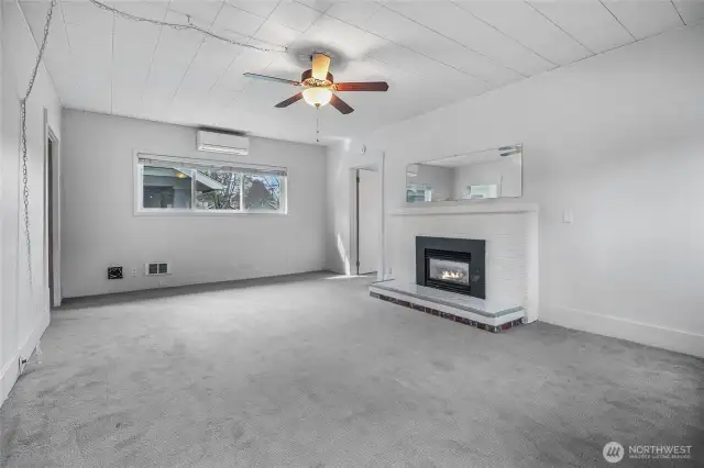 Spacious living room with HP mini-split for heating & cooling.
