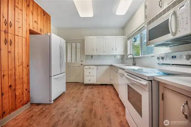 Bright kitchen with vintage cabinetry.