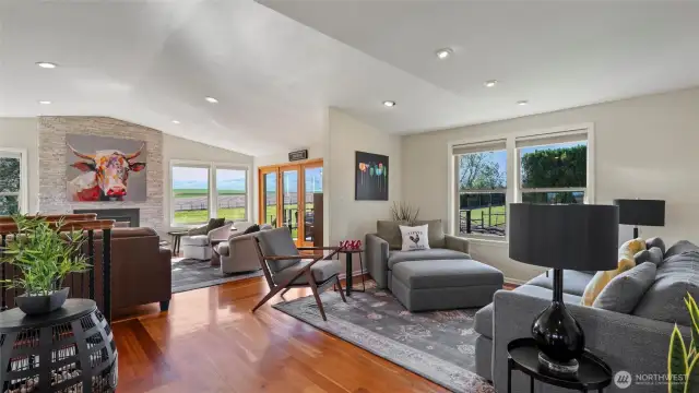 Back inside, you'll find the "cocktail" space or second conversation area. This home begs you to entertain!