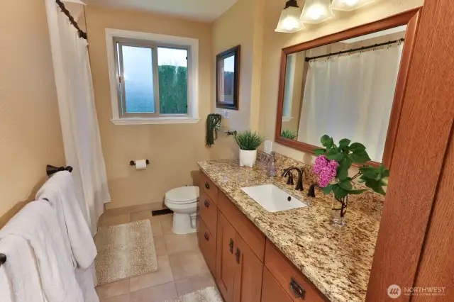 Full hallway bath with soaking tub.