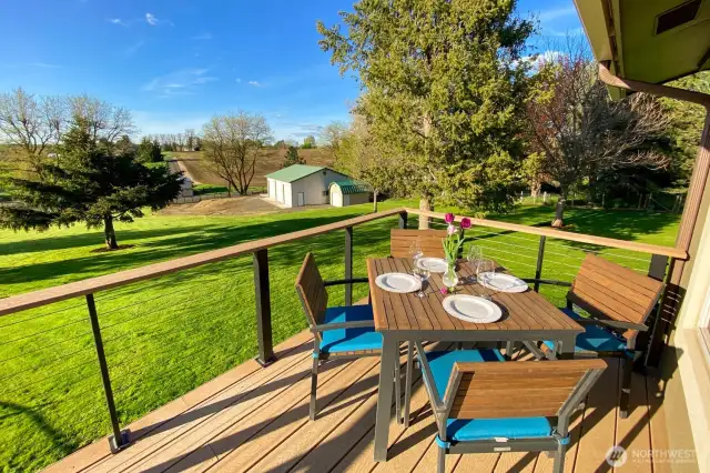 The front deck runs the length of the home and is a great spot to catch morning shade and vivid sunsets.