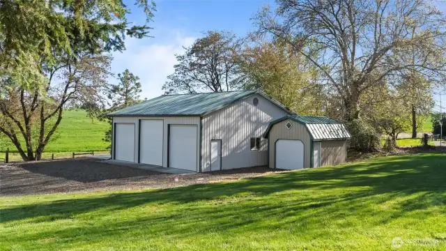 This property features this 1300 s.f. shop with 3 oversized bays PLUS a garden shed with cement floor. The shop has 220 power and a exterior RV pad on the north side.