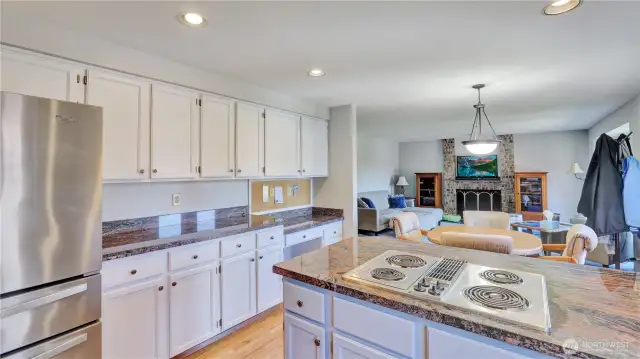 This kitchen is spacious and open with tons of cabinet space and built-in desk, making this truly the hub of the house.