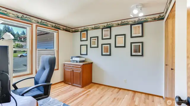 Just off the entry is a convenient main floor bedroom with new hardwood floors, great as bedroom or as home office!